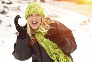 Attractive Woman Having Fun in the Snow photo