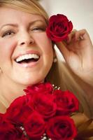 Woman with a Bunch of Red Roses. photo