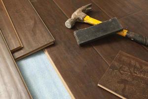 Hammer and Block with New Laminate Flooring photo