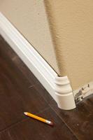 New Baseboard and Bull Nose Corners with Laminate Flooring photo