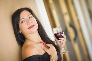 Attractive Hispanic Woman Portrait Outside Enjoying Wine photo