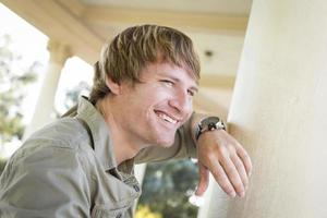 Handsome Smiling Young Man Portrait Outside photo