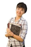 Portrait of Mixed Race Female Student Holding Books Isolated photo