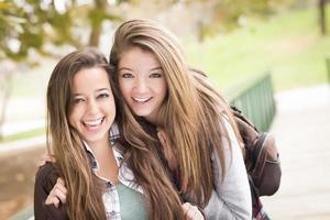 Mixed Race Women Pose for a Portrait Outside photo