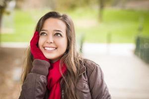 Pretty Woman Portrait Wearing Red Scarf and Mittens Outside photo