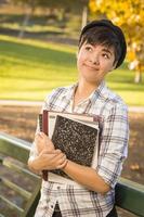 Portrait of Mixed Race Female Student Looking Away photo