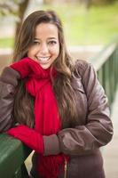Pretty Woman Portrait Wearing Red Scarf and Mittens Outside photo