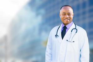 African American Male Doctor Outside of Hospital Building photo