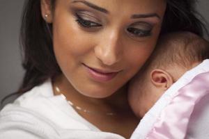 Attractive Ethnic Woman with Her Newborn Baby photo