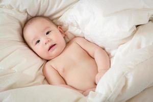 Mixed Race Baby Boy Having Fun on His Blanket photo