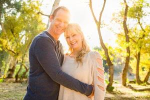 Happy Middle Aged Caucasian Couple Portrait Outdoors photo