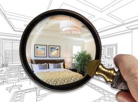 Hand Holding Magnifying Glass Revealing Finished Master Bedroom Over Drawing photo