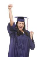 Excited Mixed Race Graduate in Cap and Gown Cheering photo