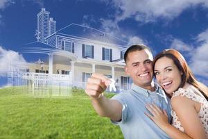 Military Couple Holding House Keys with Ghosted House Drawing Behind photo