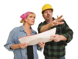 Contractor in Hard Hat Discussing Plans with Woman On White photo
