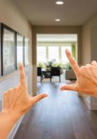 Framing Hands Looking Down Hallway of House photo