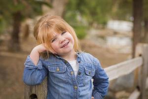 Cute Young Girl Posing for a Portrait Outside photo