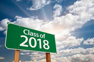 Class of 2018 Green Road Sign with Dramatic Clouds and Sky photo