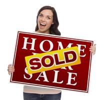 Mixed Race Female with Sold Home For Sale Sign photo