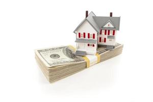 Small House on Stack of Hundred Dollar Bills photo