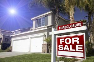 Red Foreclosure For Sale Real Estate Sign and House photo