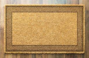 Blank Welcome Mat On Wood Floor Background Ready For Your Own Text photo