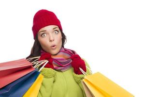 Mixed Race Woman Wearing Hat and Gloves Holding Shopping Bags photo
