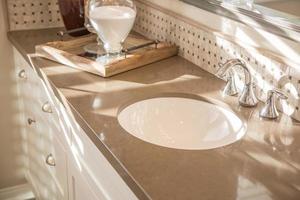 Beautifully Decorated New Modern Home Bathroom Sink, Faucet and Counter. photo