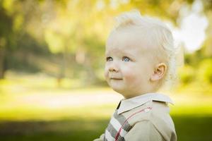 Adorable Blonde Baby Boy Outdoors at the Park photo