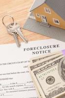 Foreclosure Notice, Home, House Keys and Stack of Money photo