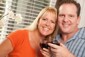 Happy Couple Enjoying Wine photo