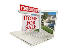 Foreclosure Home for Sale Sign and Laptop photo