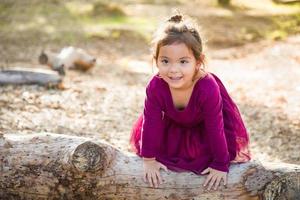 Cute Young Mixed Race Baby Girl Playing Outdoors photo