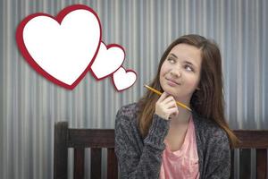 Daydreaming Girl With Blank Floating Hearts - Clipping Path photo