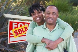 Happy Couple and Real Estate Sign photo