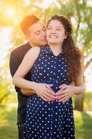 Hispanic Pregnant Young Couple Portrait Outdoors photo