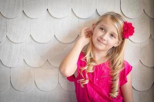 Cute Young Caucasian Girl Portrait Against A Wall photo