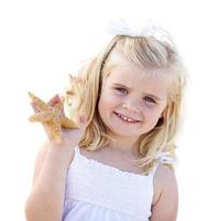 Adorable Little Blonde Girl with Starfish Isolated photo