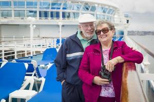 Senior Couple Enjoying The Deck of a Cruise Ship photo