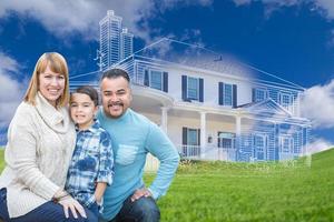 Young Mixed Race Family and Ghosted House Drawing on Grass photo