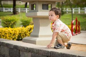 Young Chinese and Caucasian Boy Having Fun at the Park. photo