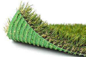 Flipped Up Section of Artificial Turf Grass On White Background photo