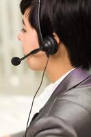 Profile of Attractive Young Mixed Race Woman Smiles Wearing Headset photo