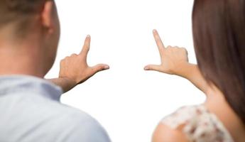 Military Couple with Framing Hands Slightly Blurry on White photo