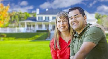 Happy Mixed Race Couple in Front of House photo