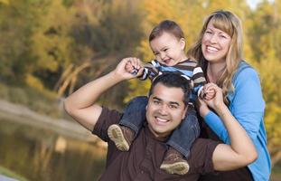 Happy Mixed Race Ethnic Family Posing for A Portrait photo