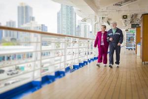 Senior Couple Enjoying The Deck of a Cruise Ship photo