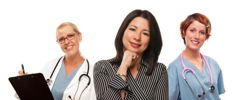 Hispanic Woman with Female Doctors and Nurses photo