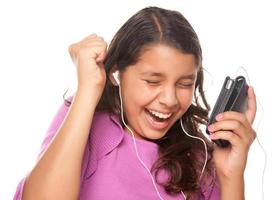 Pretty Hispanic Girl Listening and Dancing to Music photo