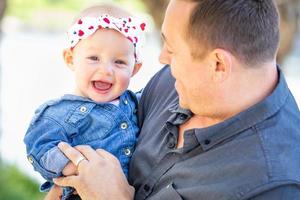 Young Caucasian Father and Baby Girl At The Park photo